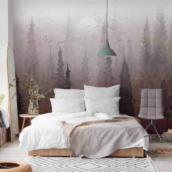 Wall Mural - Bird's flight over treetops - landscape of a dark forest in fog